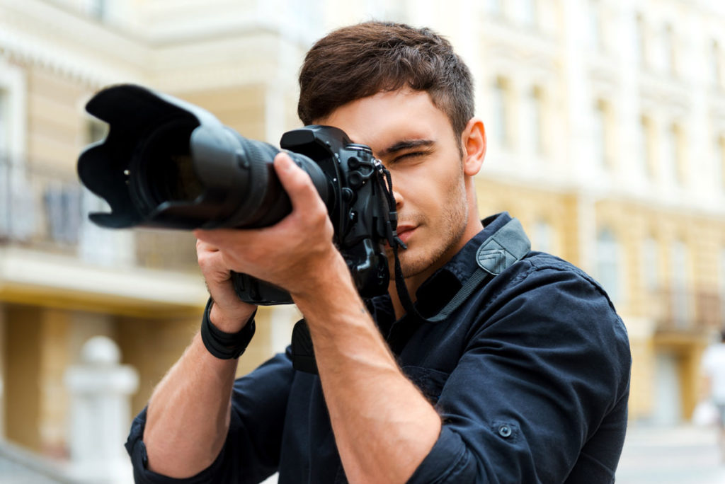 Male photographer wearing darker clothing