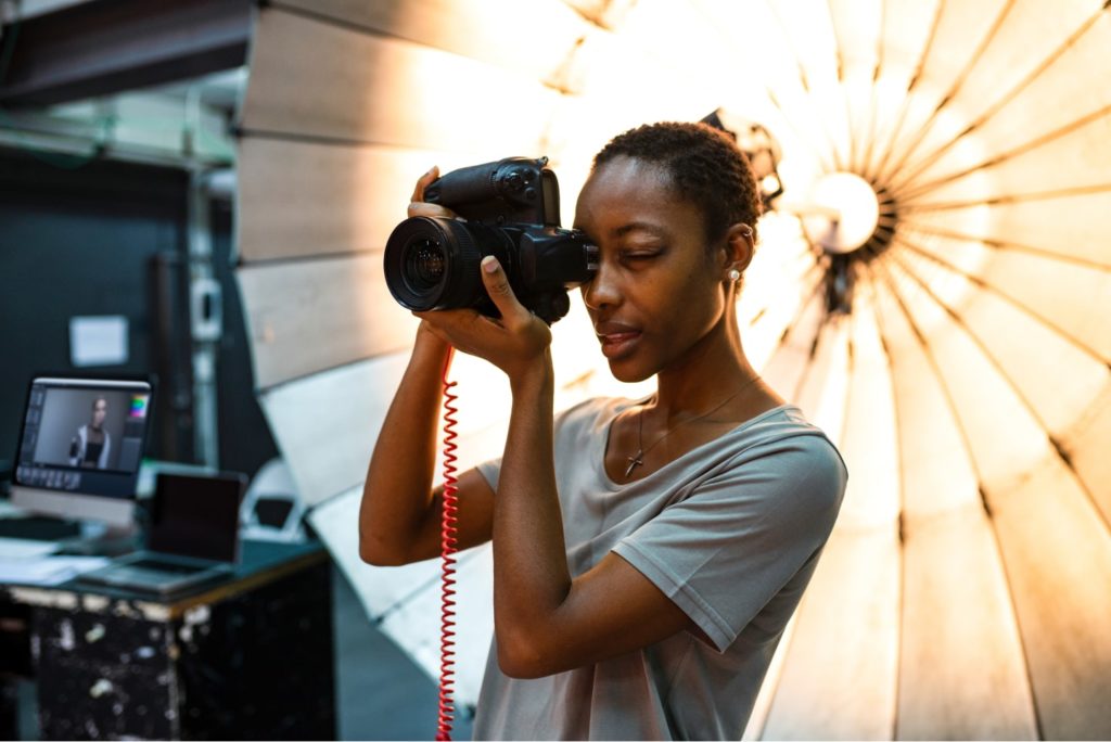 woman on set with camera