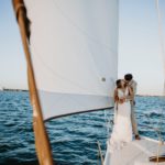 Couple in wedding clothes on a sailing ship