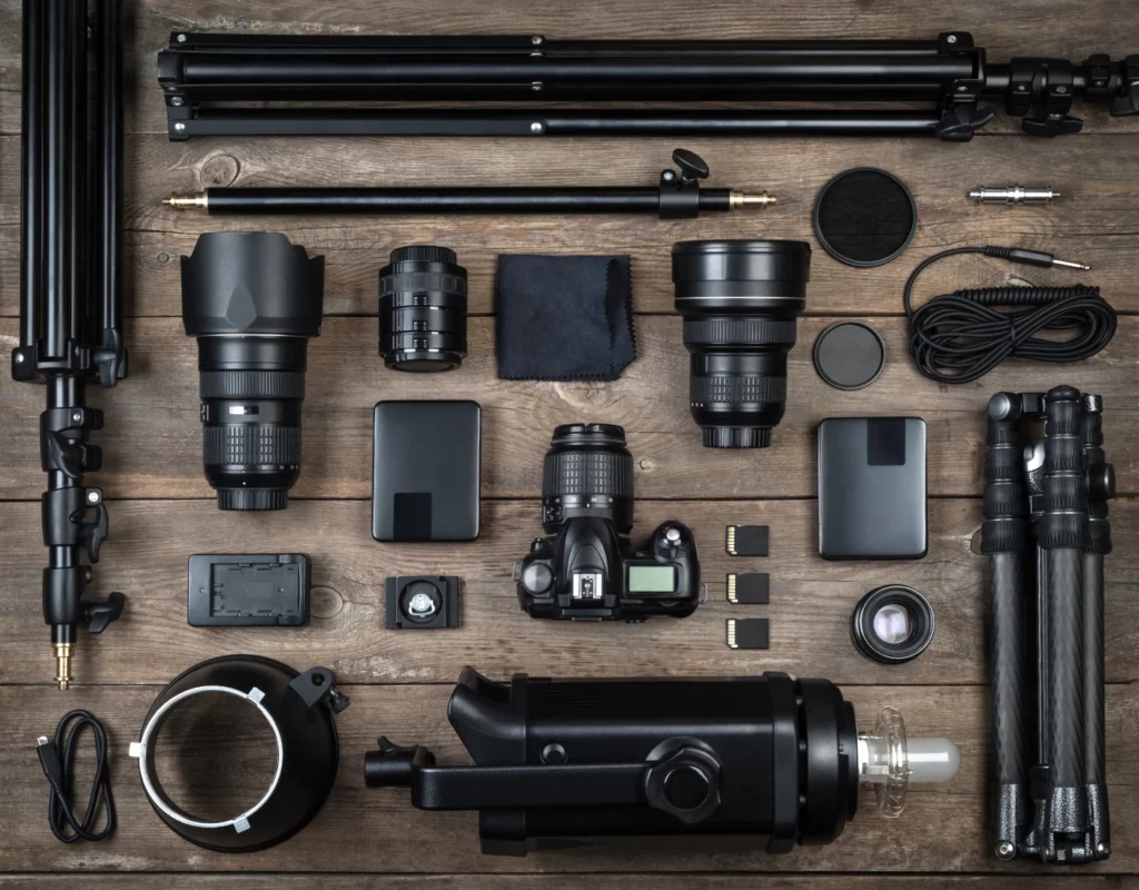Different photographer tools laid out neatly on a table.