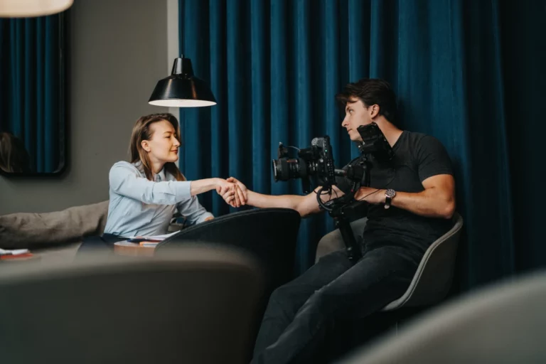 A videographer introducing himself to a business associate