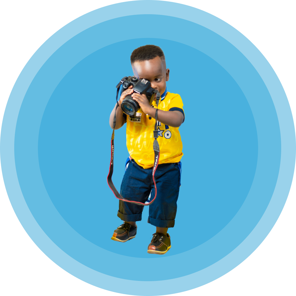 baby holding camera in a precarious way