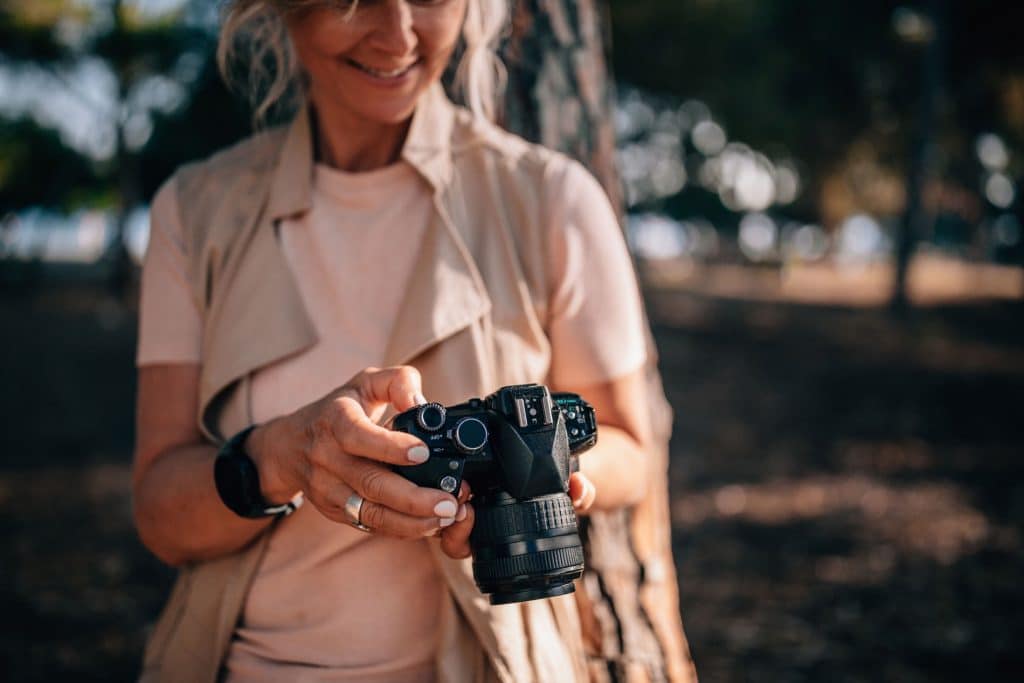 woman looking at her camera