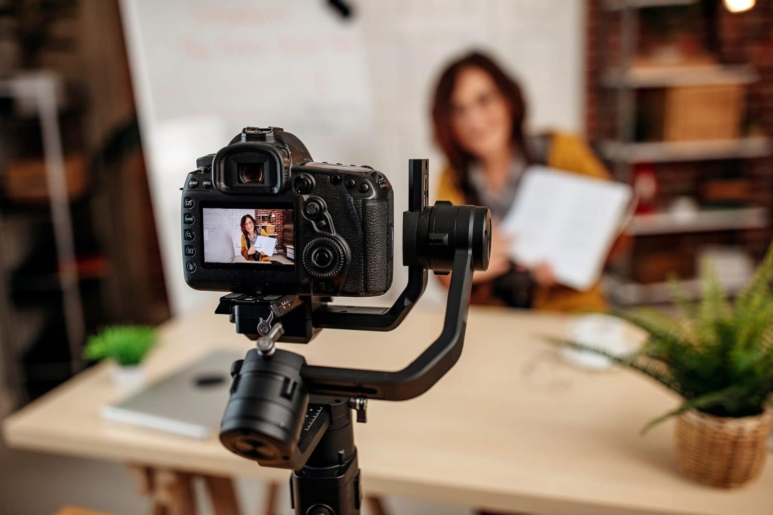 woman taking a video in her home