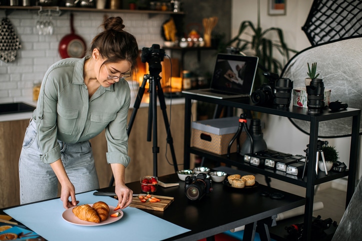 Young female photographer in her home studio office