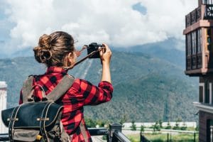 girl traveling while taking photos