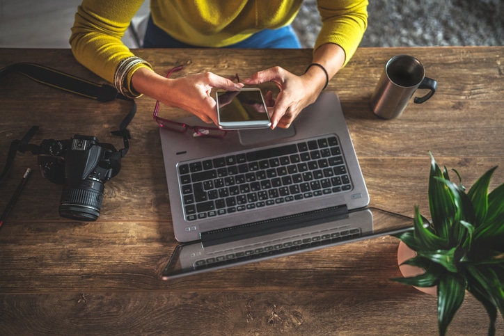 Photographers Working In Their Office