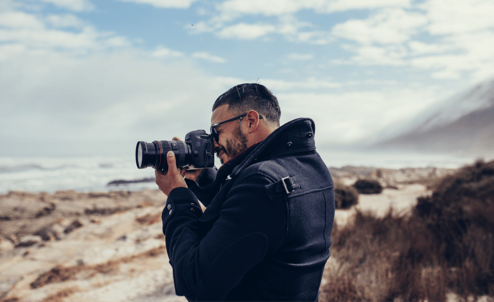 Guy outside taking photos