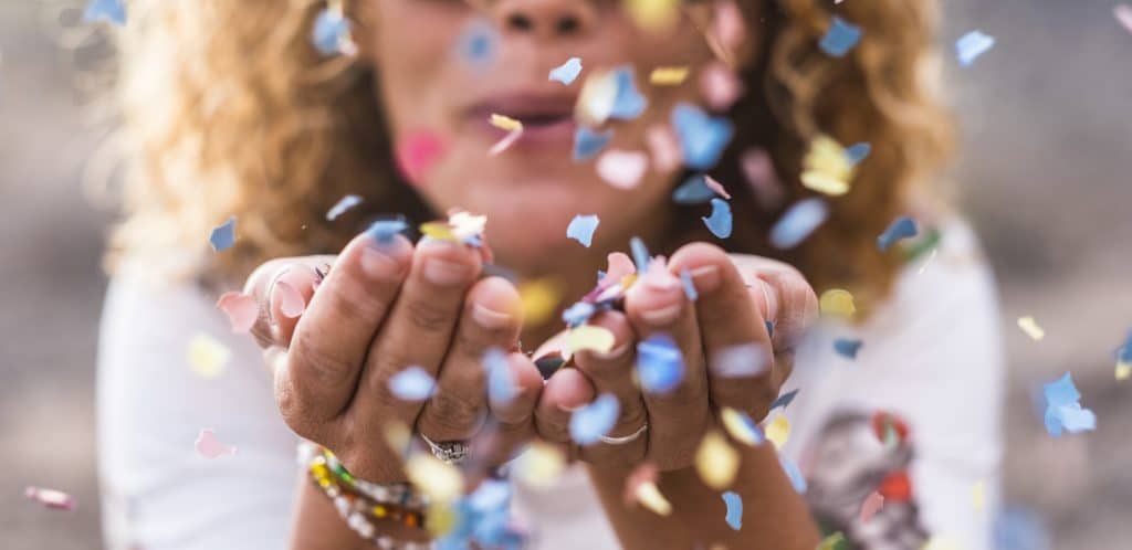 woman throwing confetti