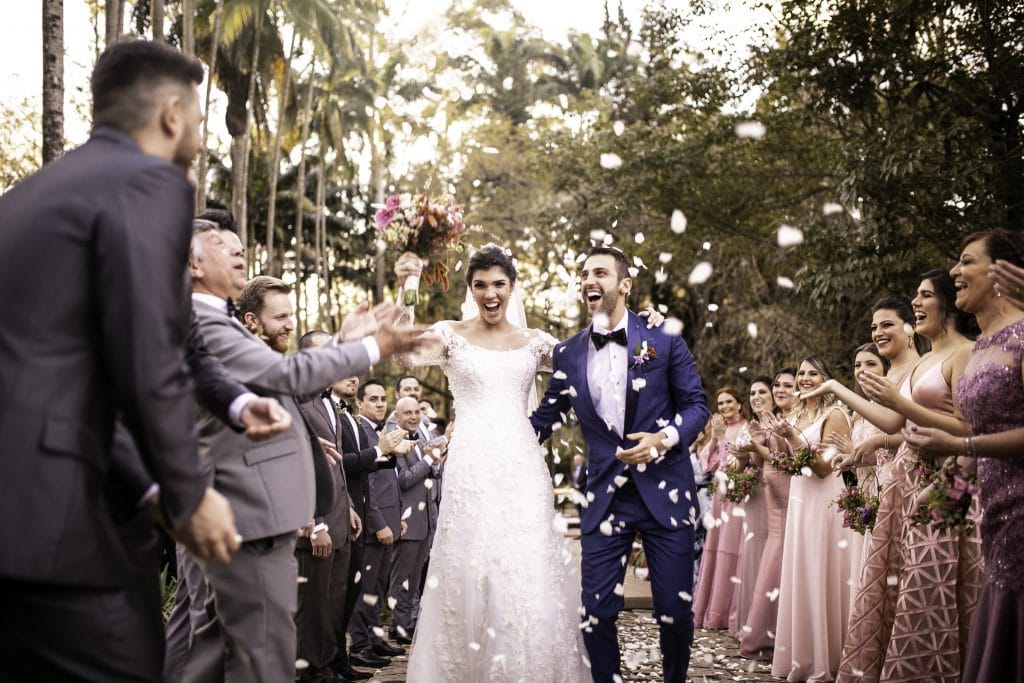 Confetti throwing on happy newlywed couple